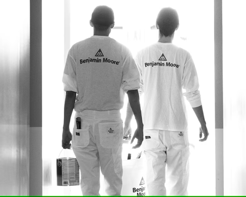 Two Benjamin Moore employees working at a U.S. paint facility